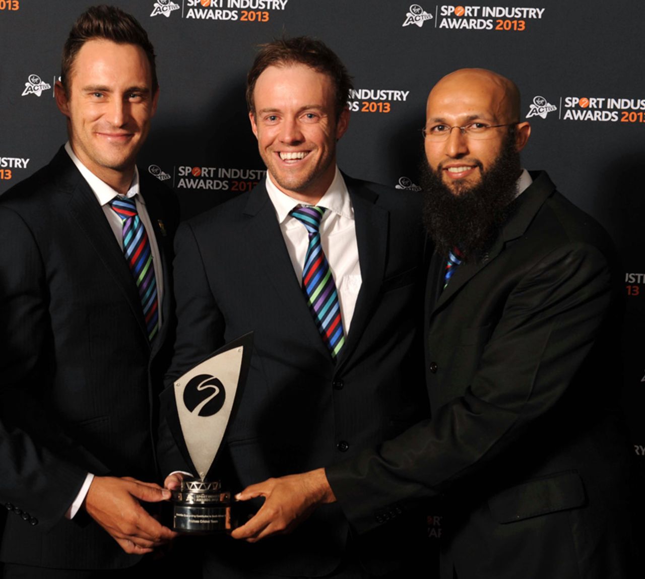 Faf du Plessis, AB de Villiers and Hashim Amla with the Deloitte Outstanding Contribution to South African Sport Award during the Virgin Active Sport Industry Awards in Johannesburg, February 7, 2013