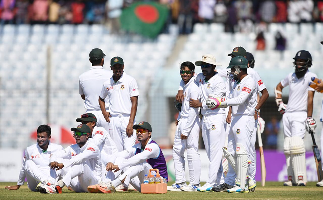 The Bangladesh players wait for the outcome of another review, Bangladesh v England, 1st Test, Chittagong, 1st day, October 20, 2016