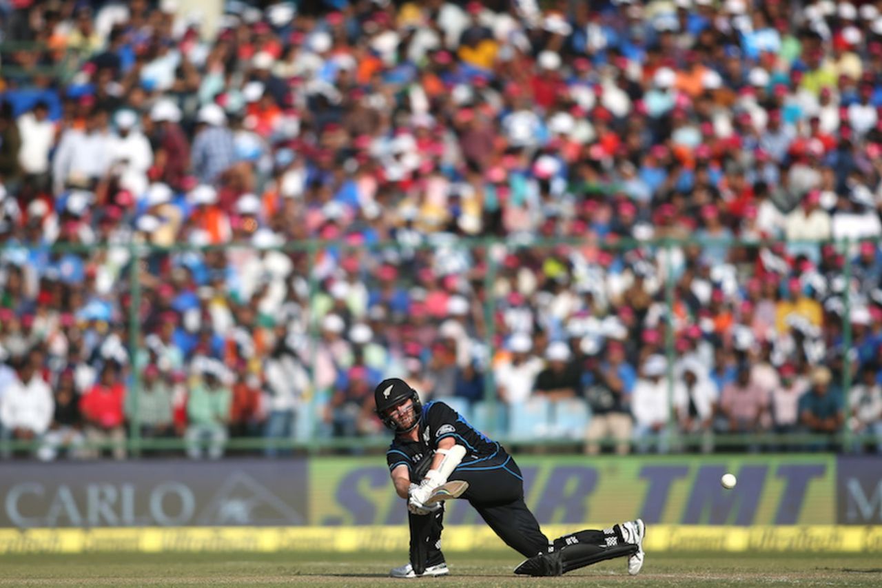 Kane Williamson sweeps with a packed stand in the background, India v New Zealand, 2nd ODI, Delhi, October 20, 2016