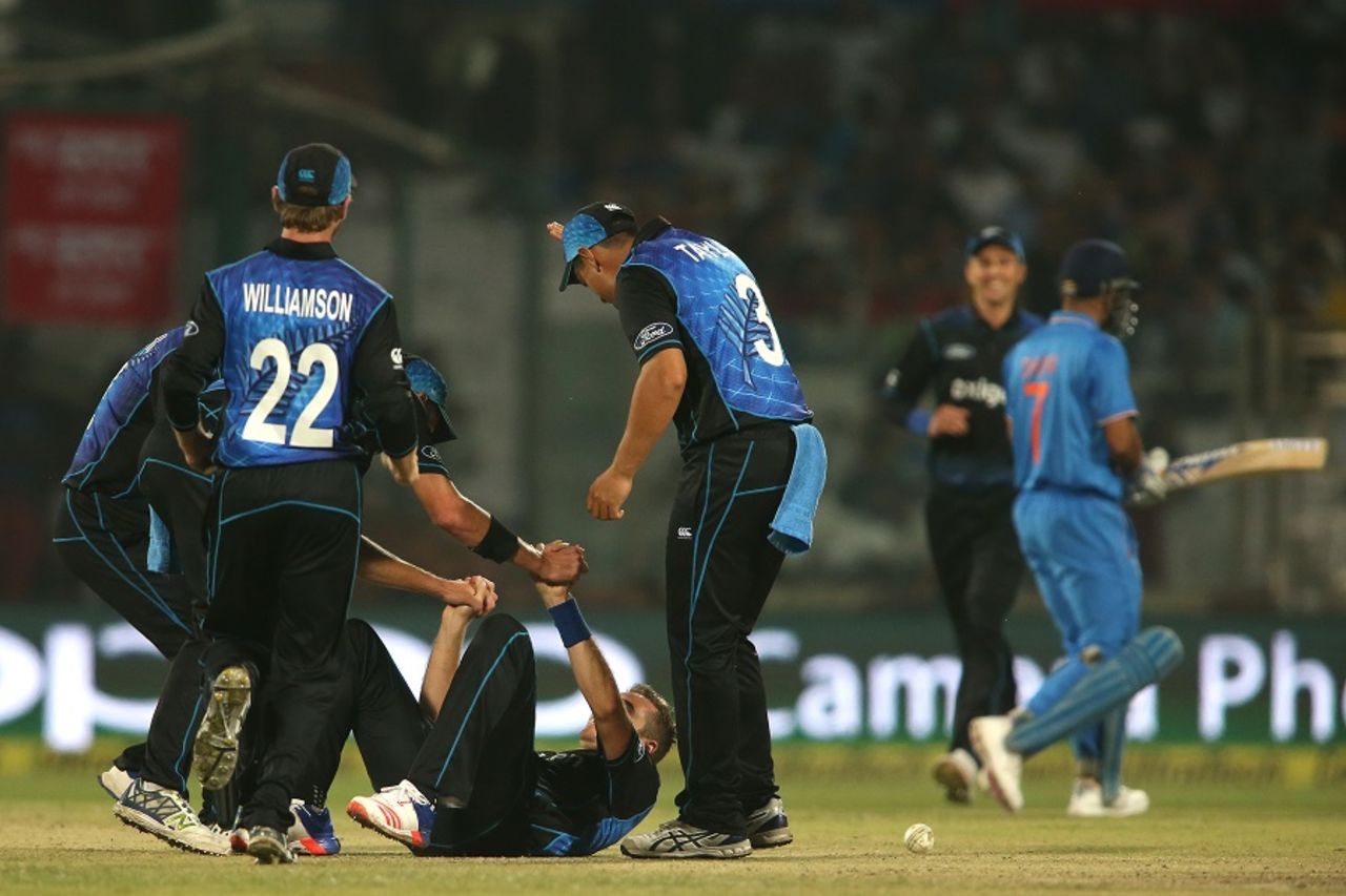 Tim Southee is mobbed by team-mates after taking a wicket, India v New Zealand, 2nd ODI, Delhi, October 20, 2016