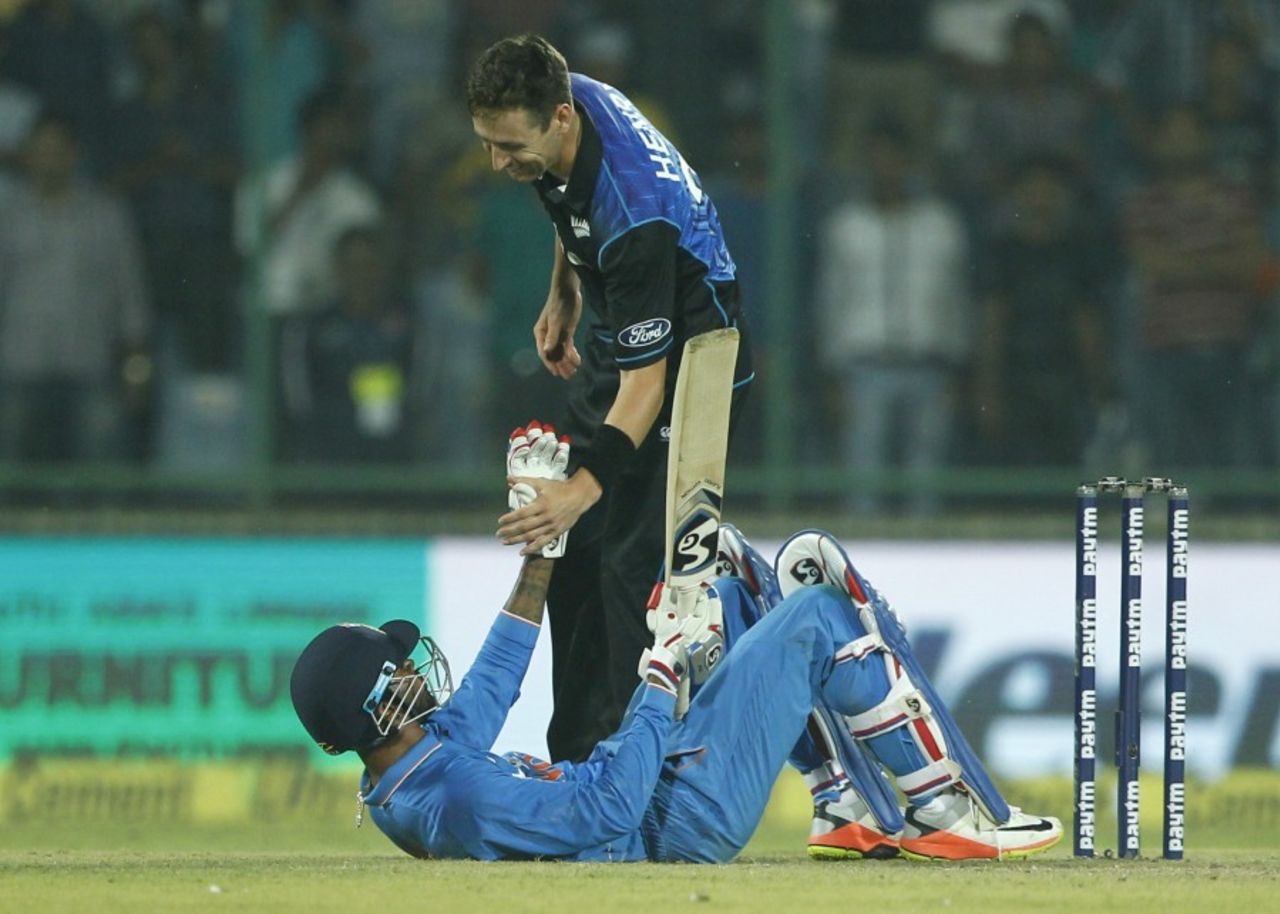 Matt Henry helps Hardik Pandya to his feet, India v New Zealand, 2nd ODI, Delhi, October 20, 2016