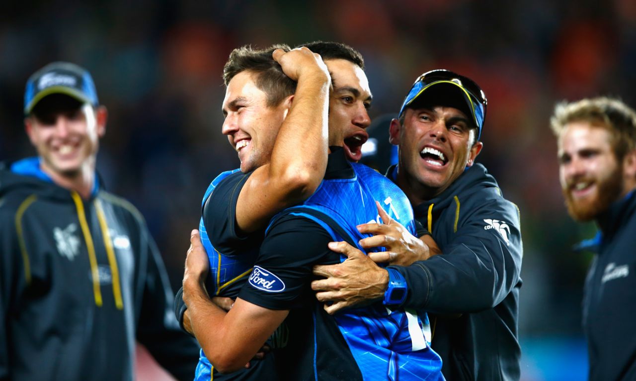 Ross Taylor and Chris Donaldson hug Trent Boult after the win, New Zealand v South Africa, World Cup 2015, 1st semi-final, Auckland, March 24, 2015