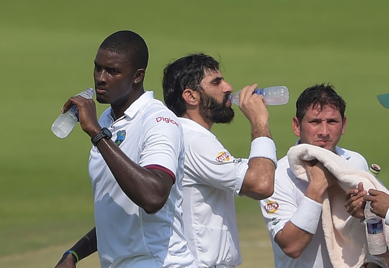 The two captains - Jason Holder and Misbah-ul-Haq - take a drinks break, Pakistan v West Indies, 2nd Test, Abu Dhabi, 2nd day, October 22, 2016