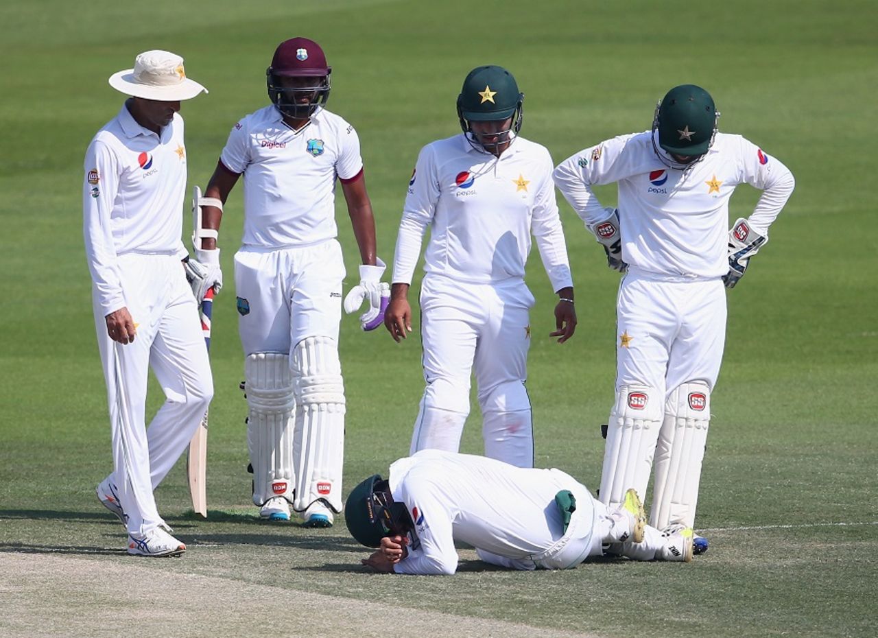 Team-mates check on Azhar Ali after he was struck, Pakistan v West Indies, 2nd Test, Abu Dhabi, 3rd day, October 23, 2016