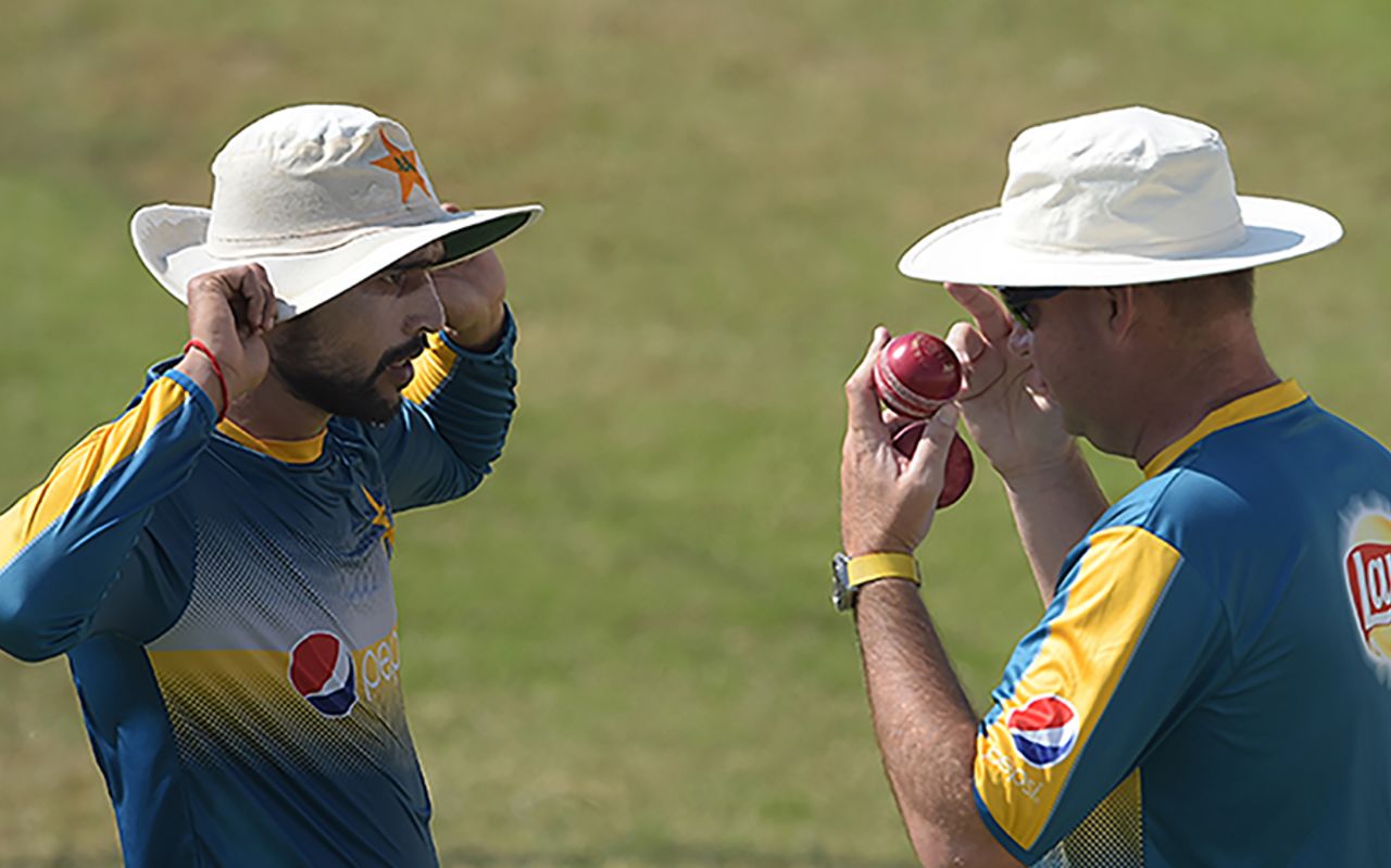 Mohammad Amir and Mickey Arthur have a discussion during a training session, Sharjah, October 29, 2017