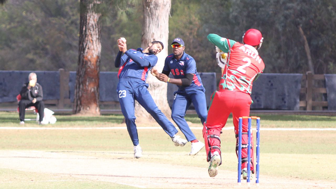 Ali Khan takes a return catch with his eyes closed to remove Arun Poulose, USA v Oman, ICC World Cricket League Division Four, Los Angeles, November 1, 2016