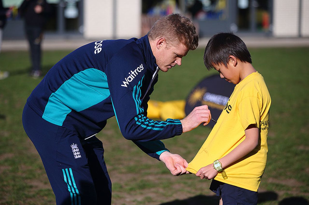 Sam Billings signs a t-shirt for a young cricketer at a Chance to Shine event, Teddington, November 2, 2016