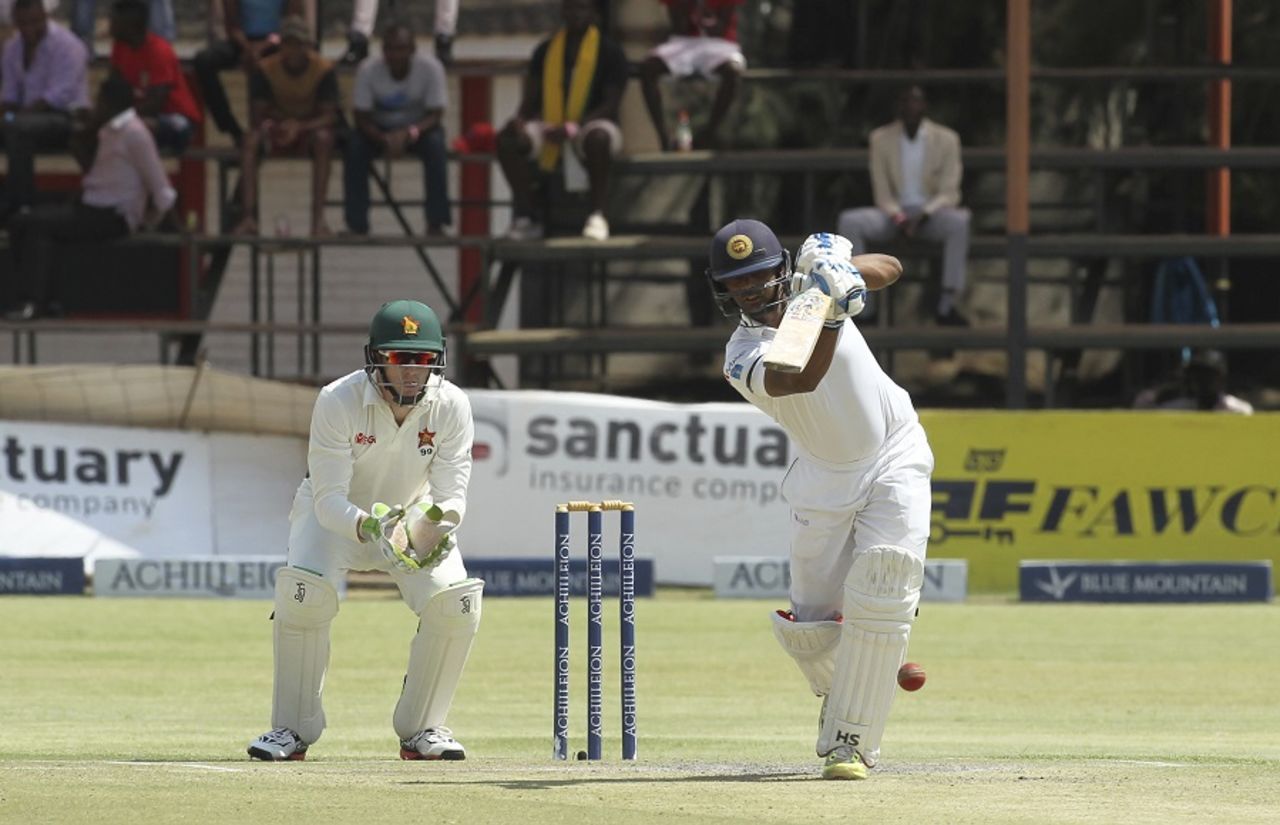 Asela Gunaratne tries to punch one down the ground, Zimbabwe v Sri Lanka, 2nd Test, Harare, 2nd day, November 7, 2016