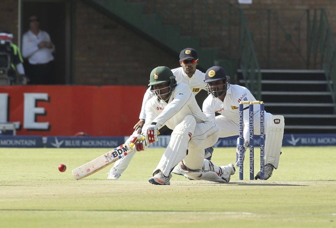 A wide-eyed Brian Chari attempts a scoop, Zimbabwe v Sri Lanka, 2nd Test, Harare, 2nd day, November 7, 2016