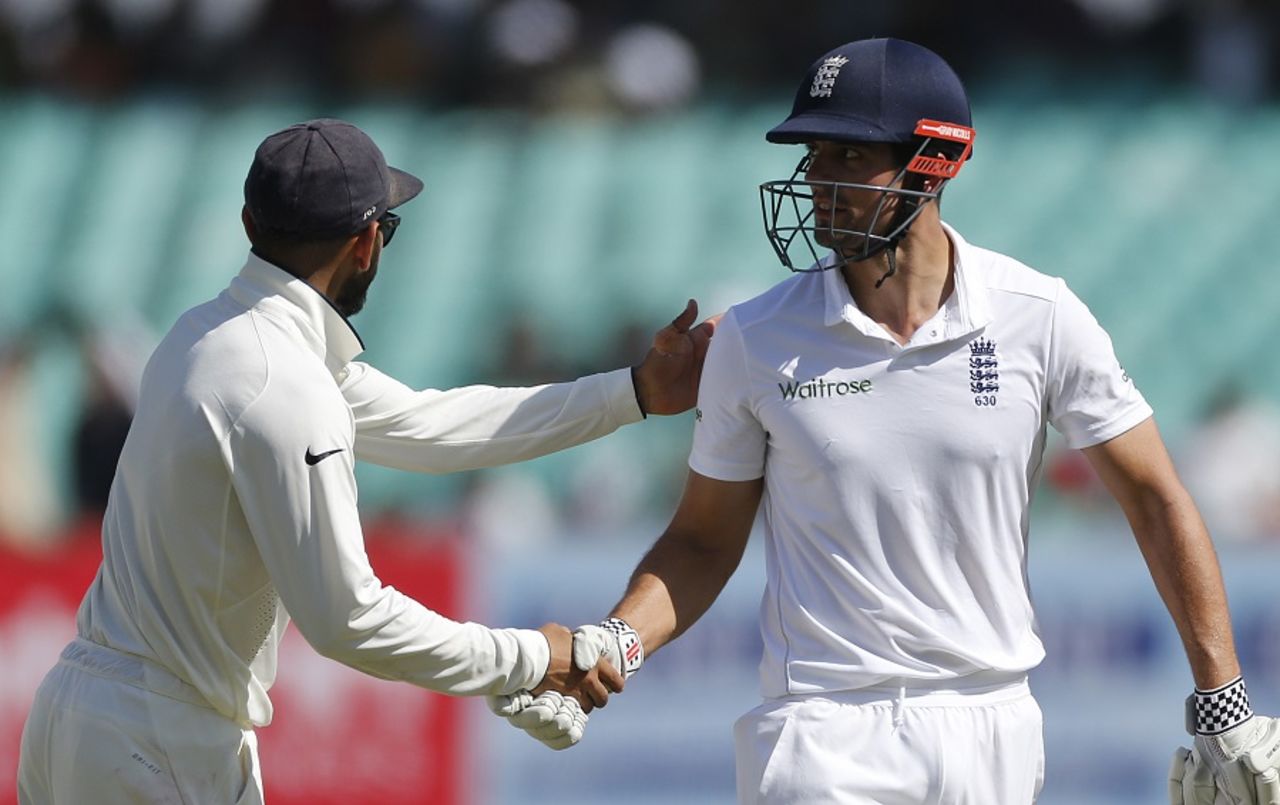 Alastair Cook is congratulated by Virat Kohli after getting to a century, India v England, 1st Test, Rajkot, 5th day, November 13, 2016