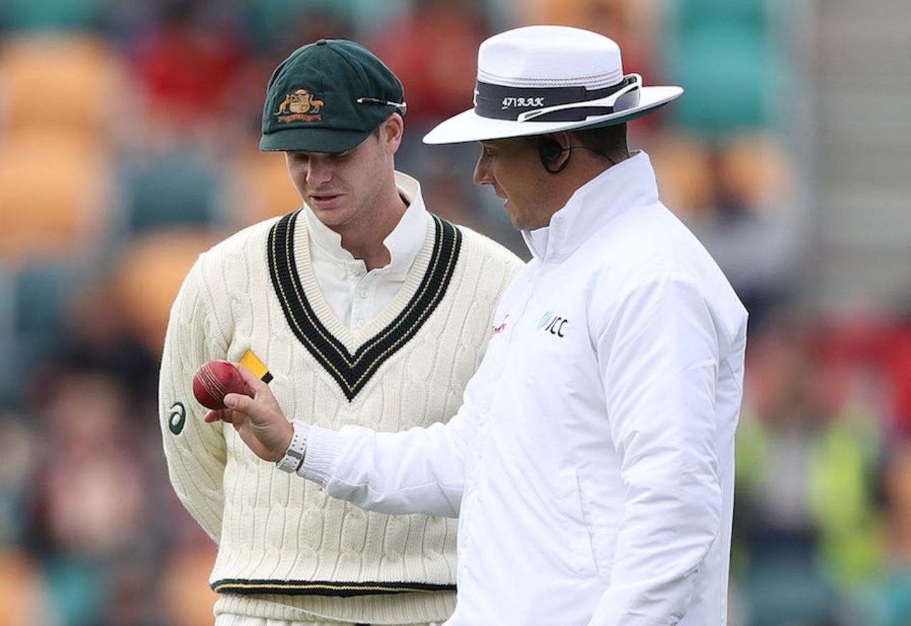 Aleem Dar and Steven Smith look at the ball, Australia v South Africa, 2nd Test, Hobart, 3rd day, November 14, 2016