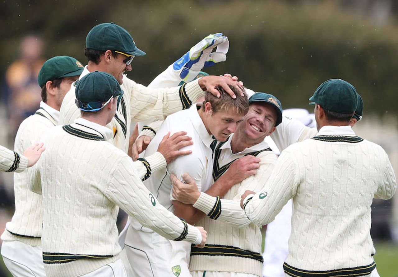 The Australians celebrate Joe Mennie's first Test wicket, Australia v South Africa, 2nd Test, Hobart, 3rd day, November 14, 2016