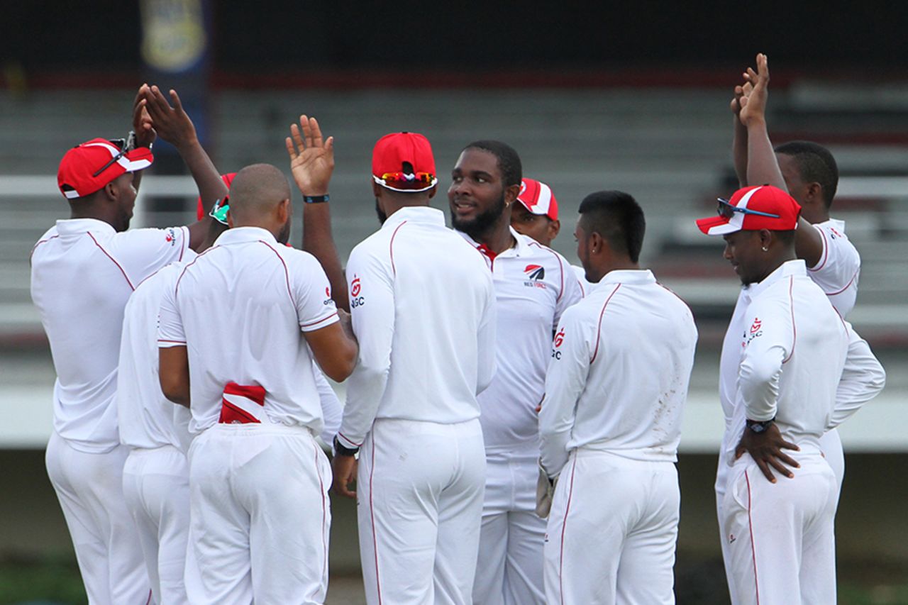 Roshon Primus celebrates with team-mates after taking a wicket, Trinidad & Tobago v Windward Islands, Regional Four-Day Competition, Port of Spain, 1st day, November 11, 2016