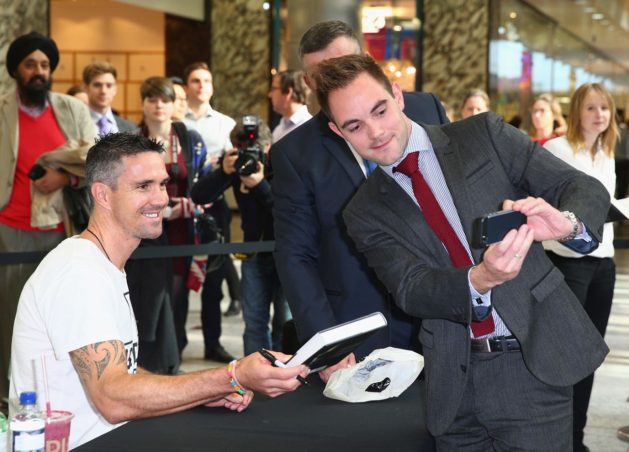 A fan takes a selfie with Kevin PIetersen at a book signing, London, October 9, 2014 