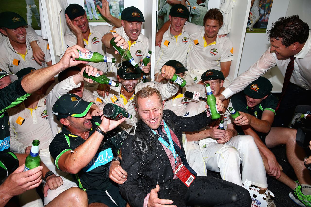 The Australian players douse their team manager, Gavin Dovey, with beer, Australia v England, Test, Perth, 5th day, December 17, 2013
