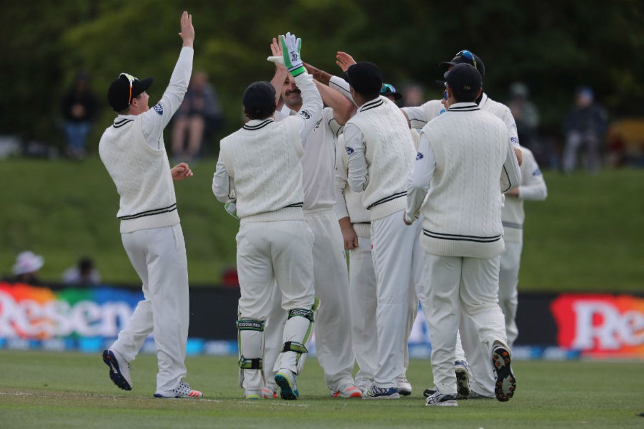 Colin de Gradhomme is congratulated by his team-mates after he picked up his first Test wicket, New Zealand v Pakistan, 1st Test, Christchurch, 2nd day, November 18, 2016