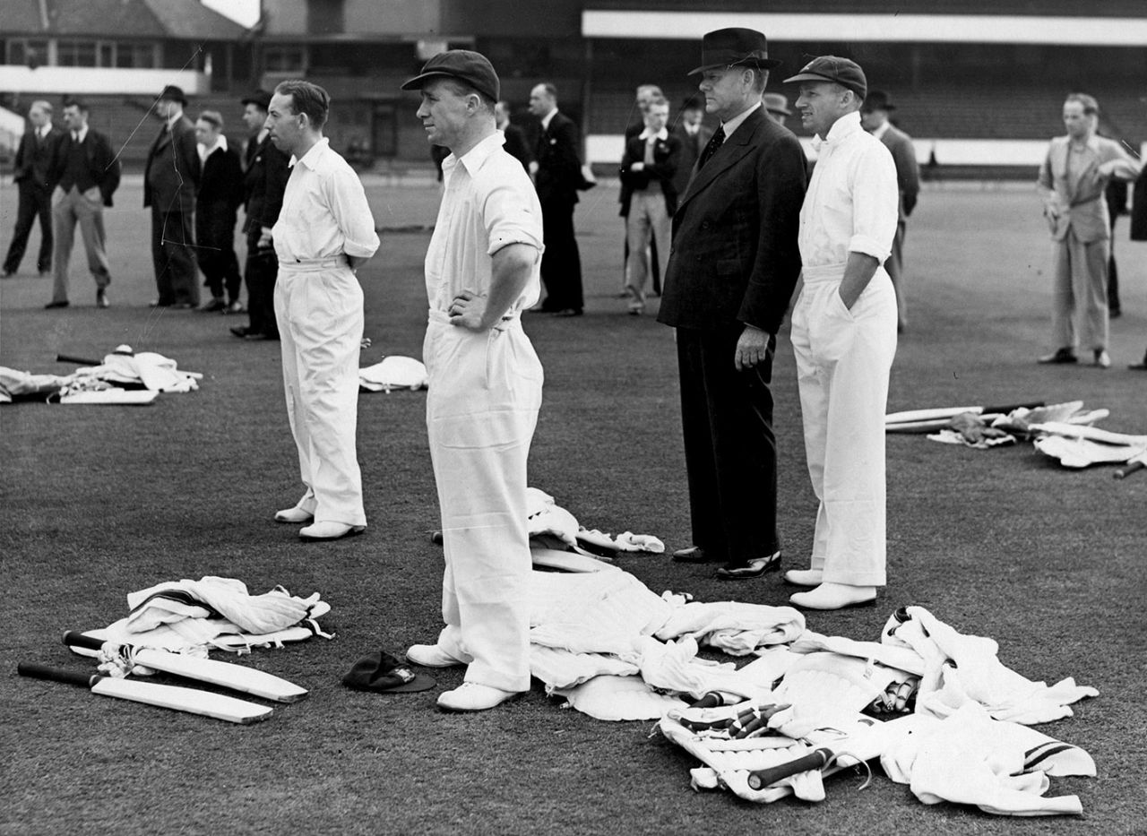 Don Bradman (hand in pocket) watches the practice session