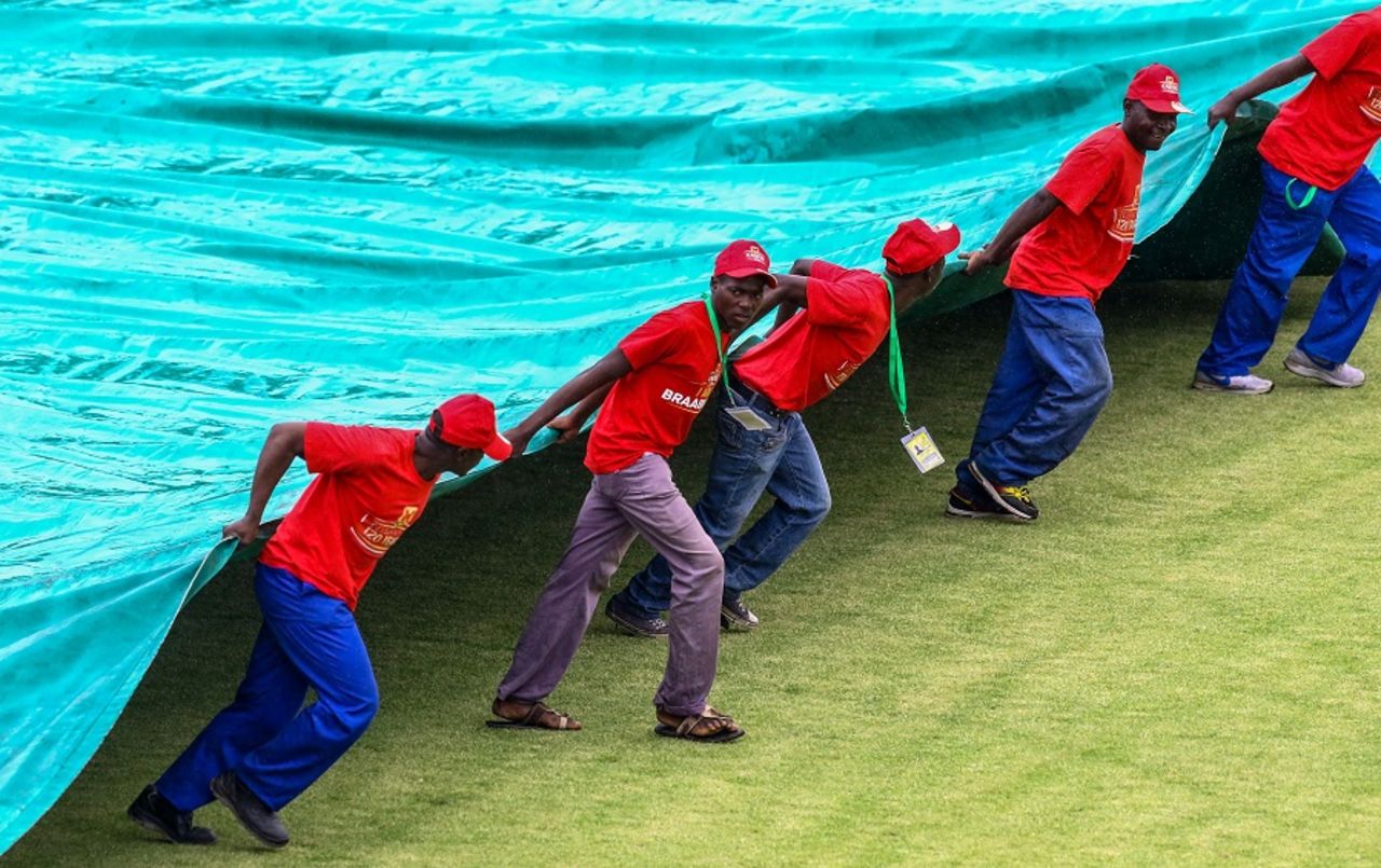 Groundstaff bring the covers on as rain stops play, Zimbabwe v West Indies, tri-series, Bulawayo, November 25, 2016