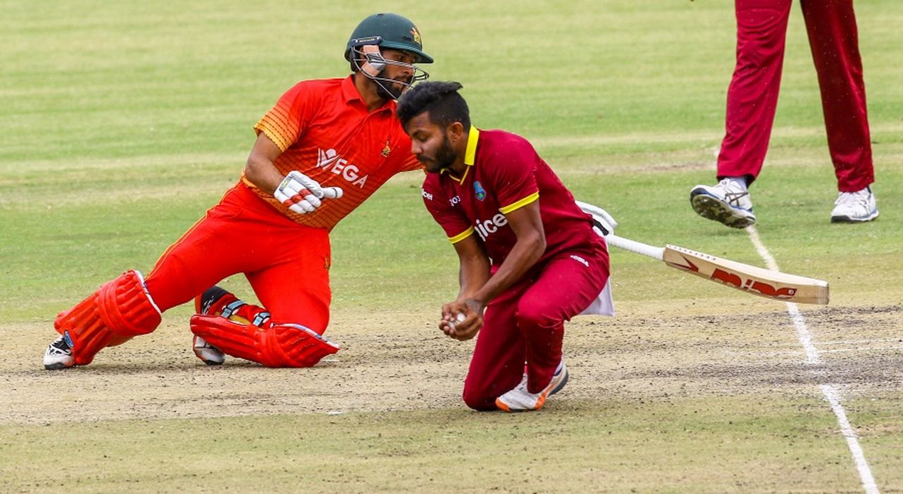 Sikandar Raza tries to get back to the crease as Devendra Bishoo fields off his own bowling, Zimbabwe v West Indies, tri-series, Bulawayo, November 25, 2016