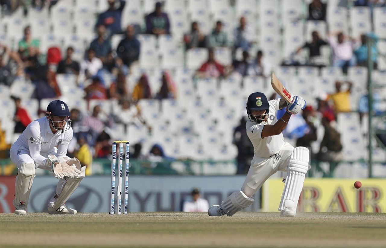 Virat Kohli dispatches the ball with a drive through cover, India v England, 3rd Test, Mohali, 2nd day, November 27, 2016
