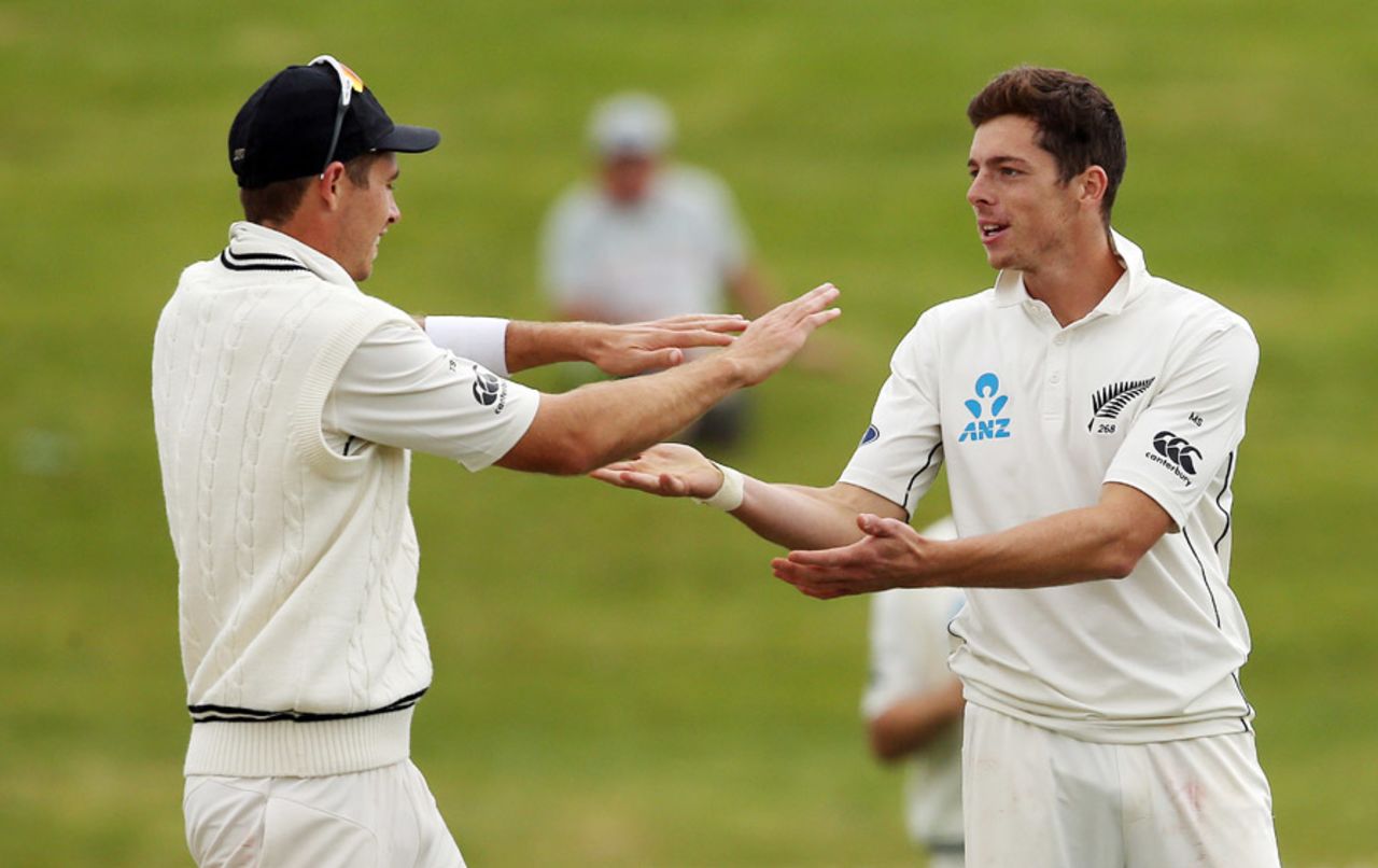 Tim Southee and Mitchell Santner celebrate after the spinner's breakthrough, New Zealand v Pakistan, 2nd Test, Hamilton, 5th day, November 29, 2016