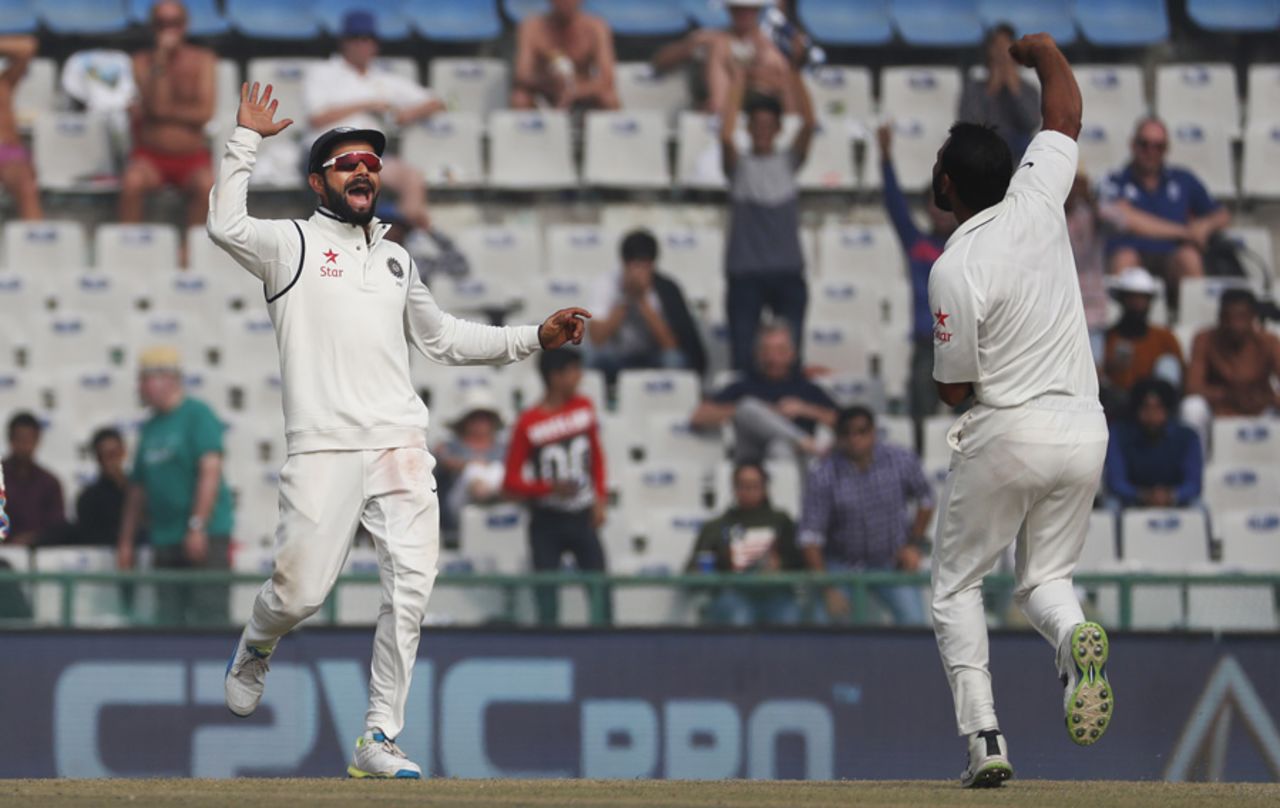 Mohammed Shami celebrates with Virat Kohli after bouncing out Chris Woakes, India v England, 3rd Test, Mohali, 4th day, November 29, 2016