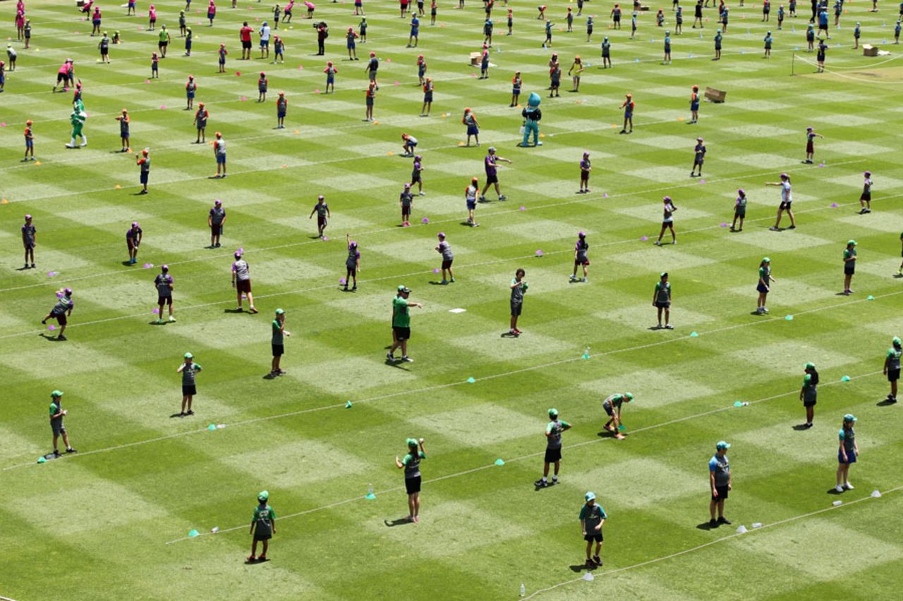 Schoolkids take part in the world's "largest cricket lesson", a Guinness World Record, Sydney, December 2, 2016
