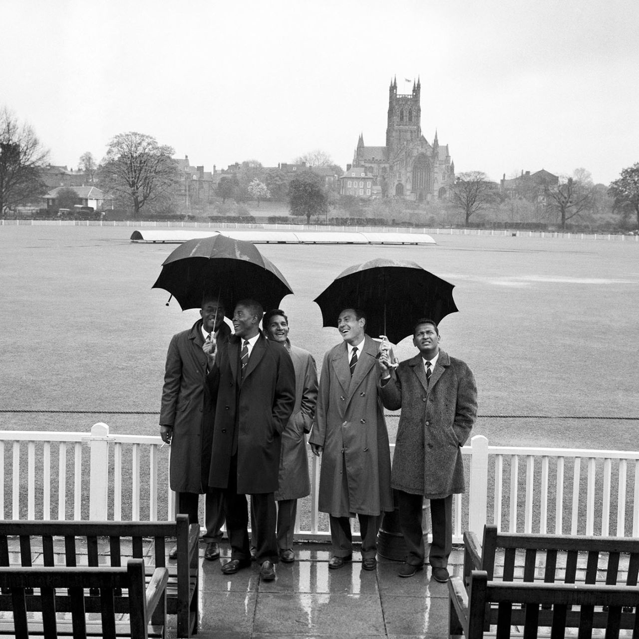 From left: Berkeley Gaskin (manager), Lester King, Deryck Murray, Willie Rodriguez and Joe Solomon of West Indies shelter from the rain that washed out the first day of the match, Worcestershire v West Indies, tour match, day one, May 1, 1963