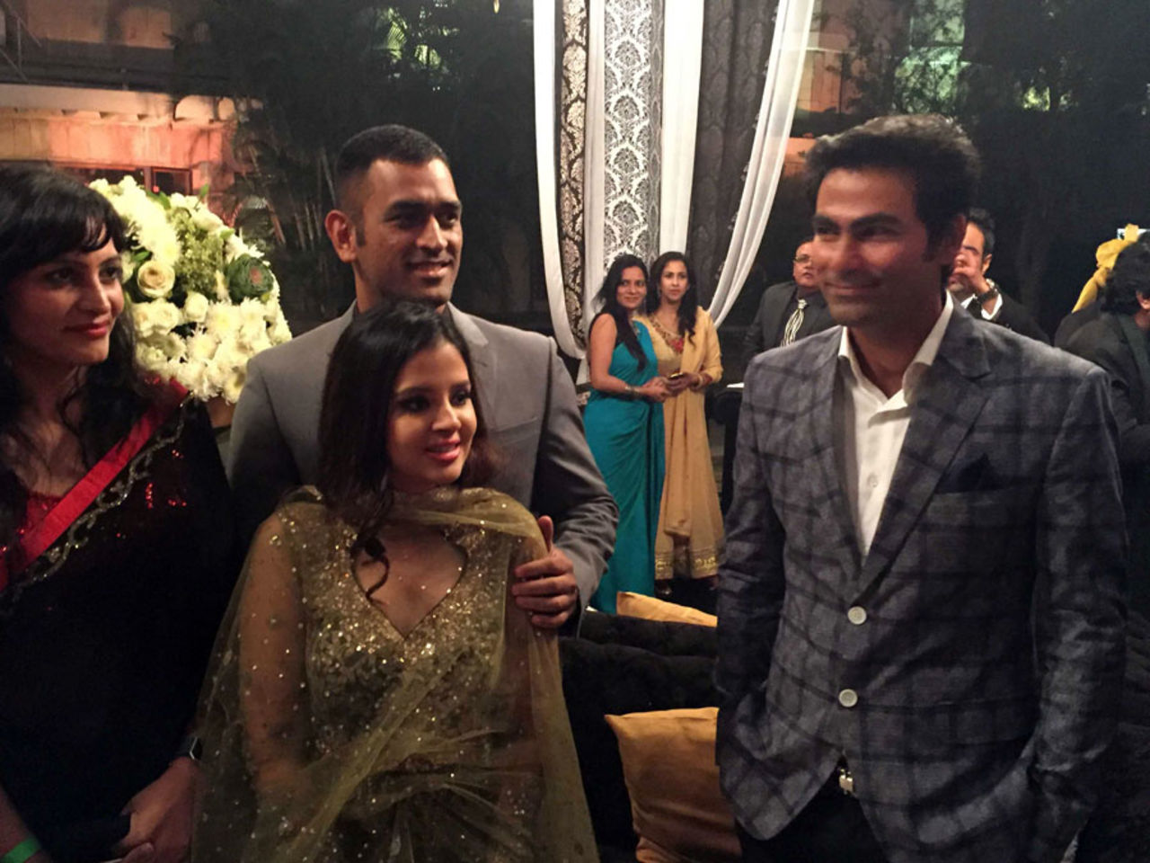 MS Dhoni and his wife Sakshi with Mohammed Kaif at Yuvraj Singh's wedding reception, Delhi, December 7, 2016