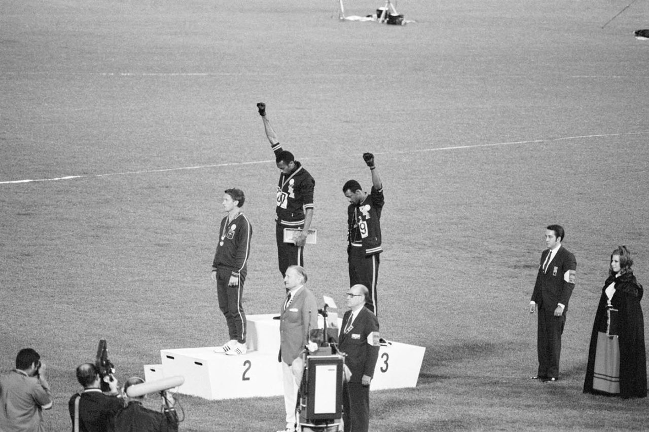 Tommie Smith and John Carlos raise their fists in a black-power salute on the podium after their win in the 200m at the Olympic Games, Mexico City, October 16, 1968