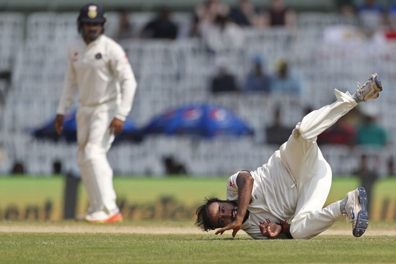 Topsy-turvy: Amit Mishra attempts to field the ball off his own bowling, 5th Test, Chennai, 2nd day, December 17, 2016