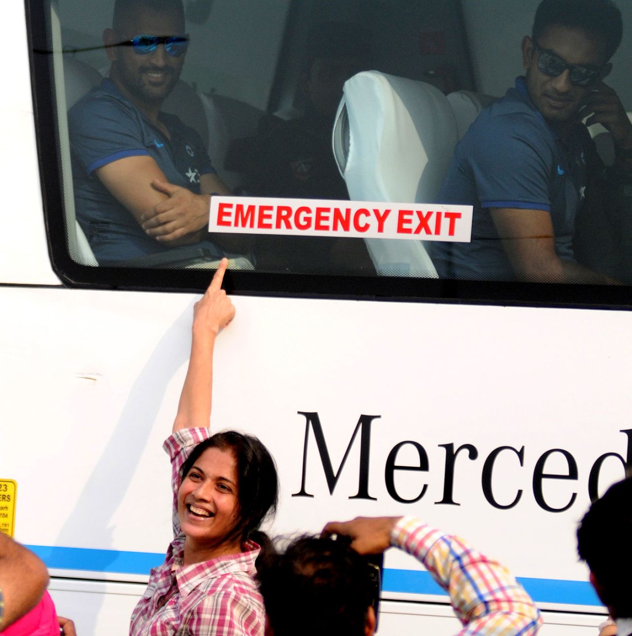 Fans greet MS Dhoni as India's team bus arrives at the stadium, October 21, 2016