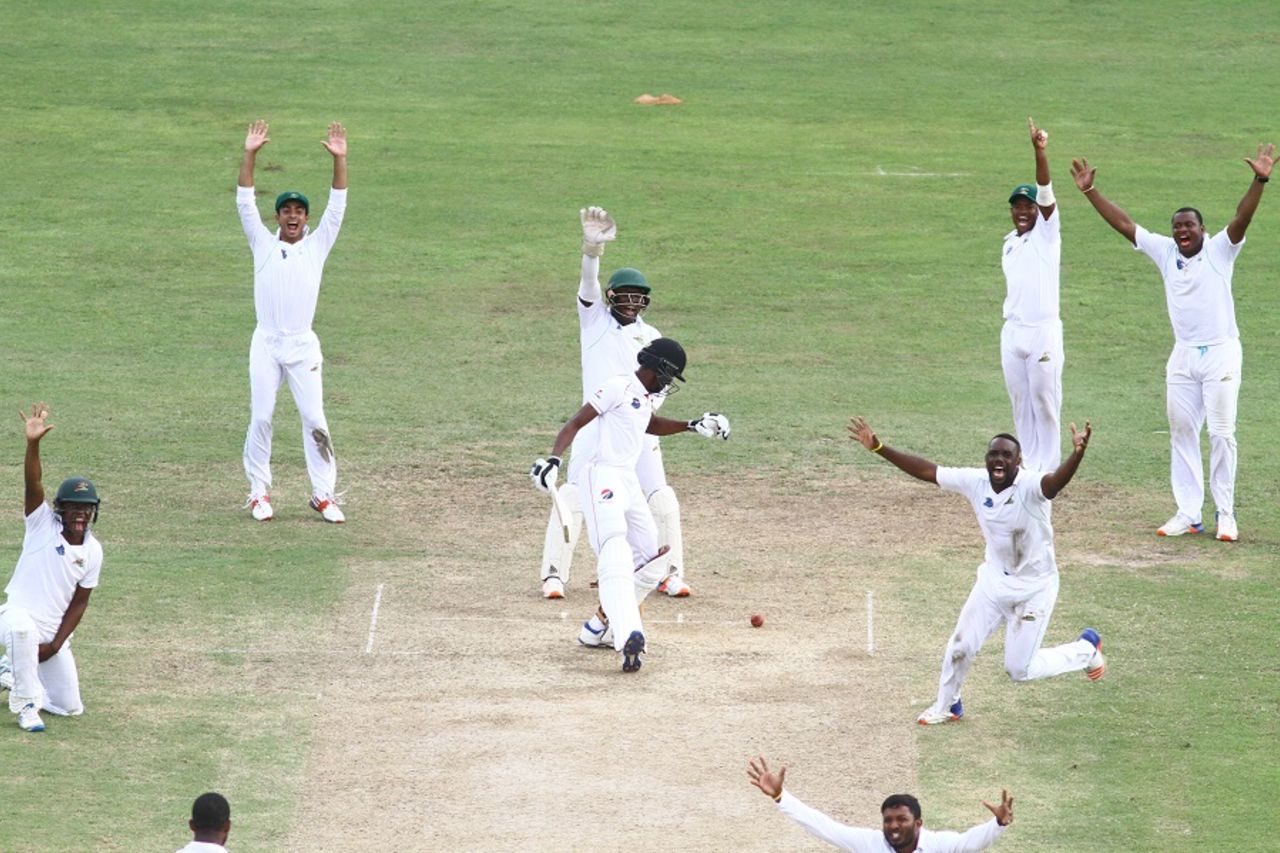 Guyana players go up in unison against Isaiah Rajah, Guyana v Trinidad & Tobago, Regional 4 Day Tournament, Providence, 3rd day, December 18, 2016