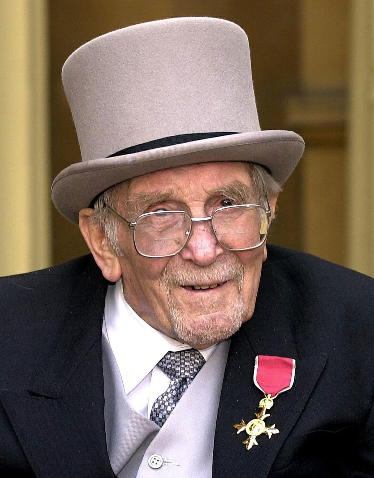 Writer Anthony Buckeridge after receiving his OBE from Queen Elizabeth at an investiture ceremony in Buckingham Palace, March 26, 2003