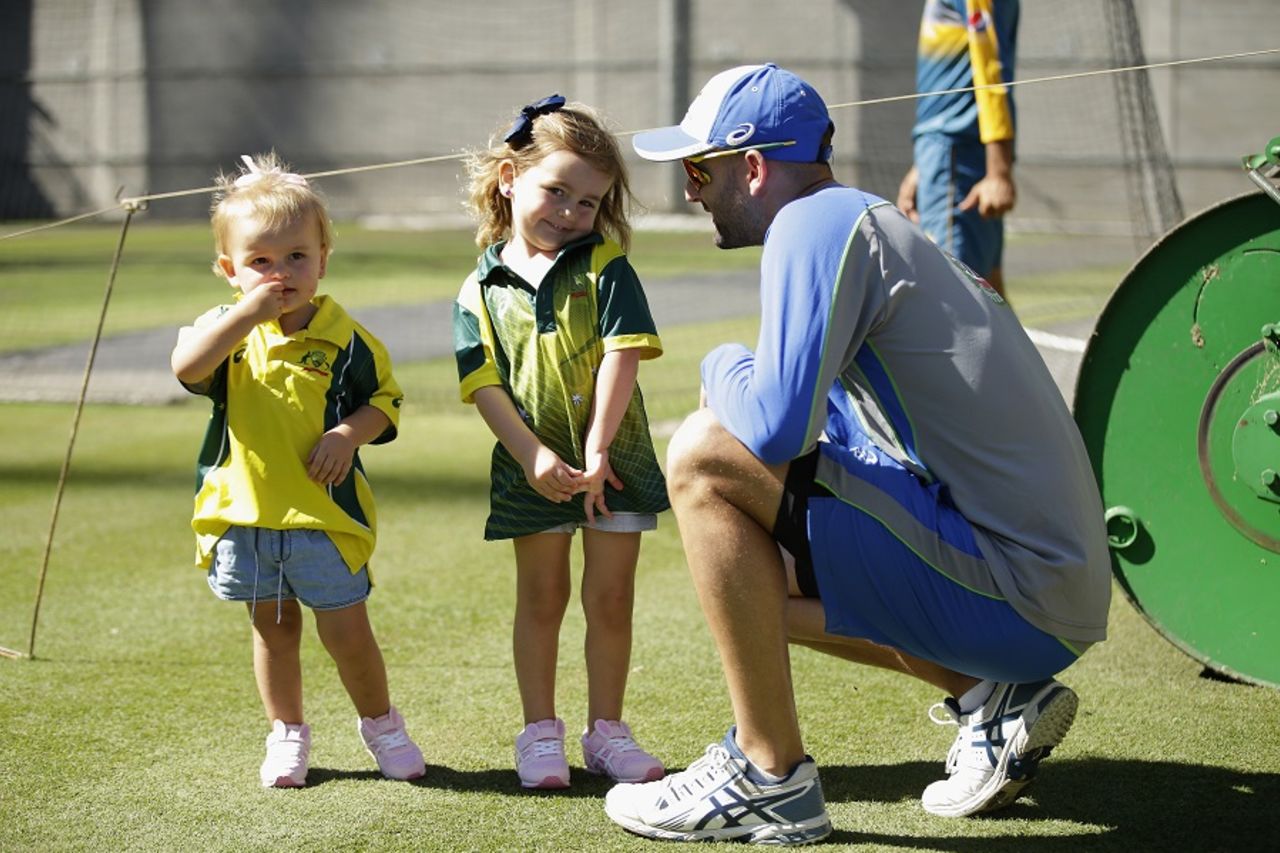 Nathan Lyon takes a break from training to spend time with his children, Melbourne, December 24, 2016