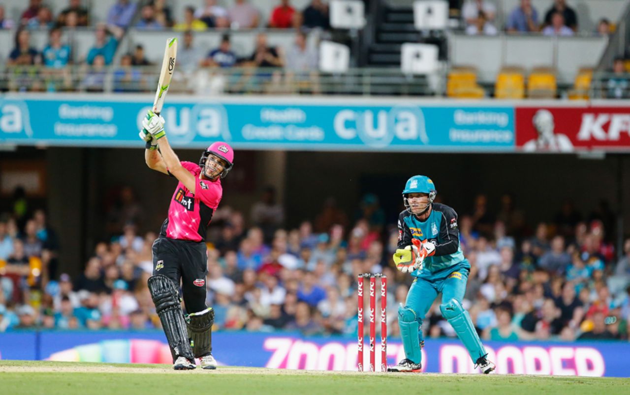 Daniel Hughes hits over the top during his 85, Heat v Sixers, Big Bash League 2016-17, Brisbane, January 3, 2017