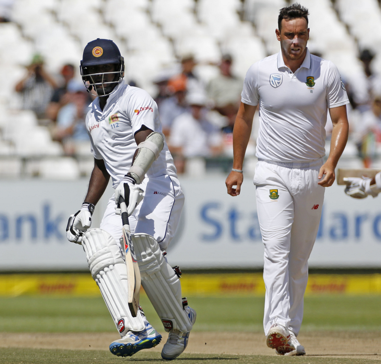 Kyle Abbott walks back as Angelo Mathews completes a run, South Africa v Sri Lanka, 2nd Test, Cape Town, 4th day, January 5, 2017