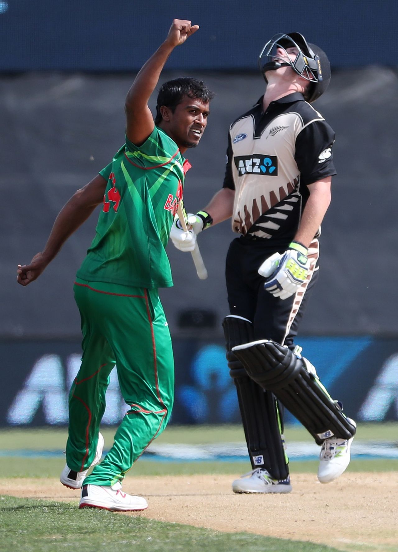 Relief and disappointment: Rubel Hossain and Colin Munro display contrasting emotions, New Zealand v Bangladesh, 2nd T20I, Mount Maunganui, January 6, 2017