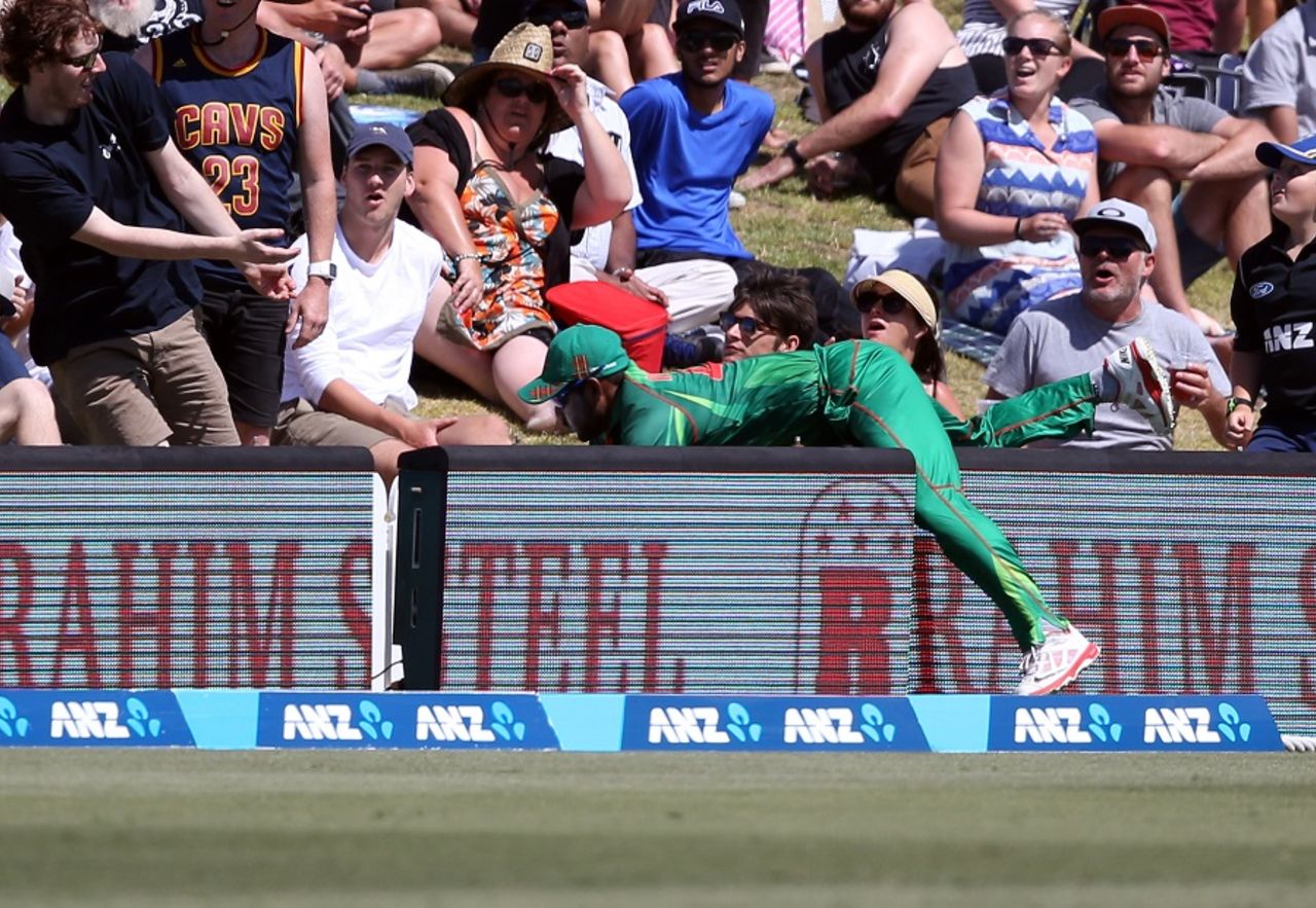 Imrul Kayes ends up in an awkward position after missing a catch on the boundary, New Zealand v Bangladesh, 3rd T20I, Mount Maunganui, January 8, 2017