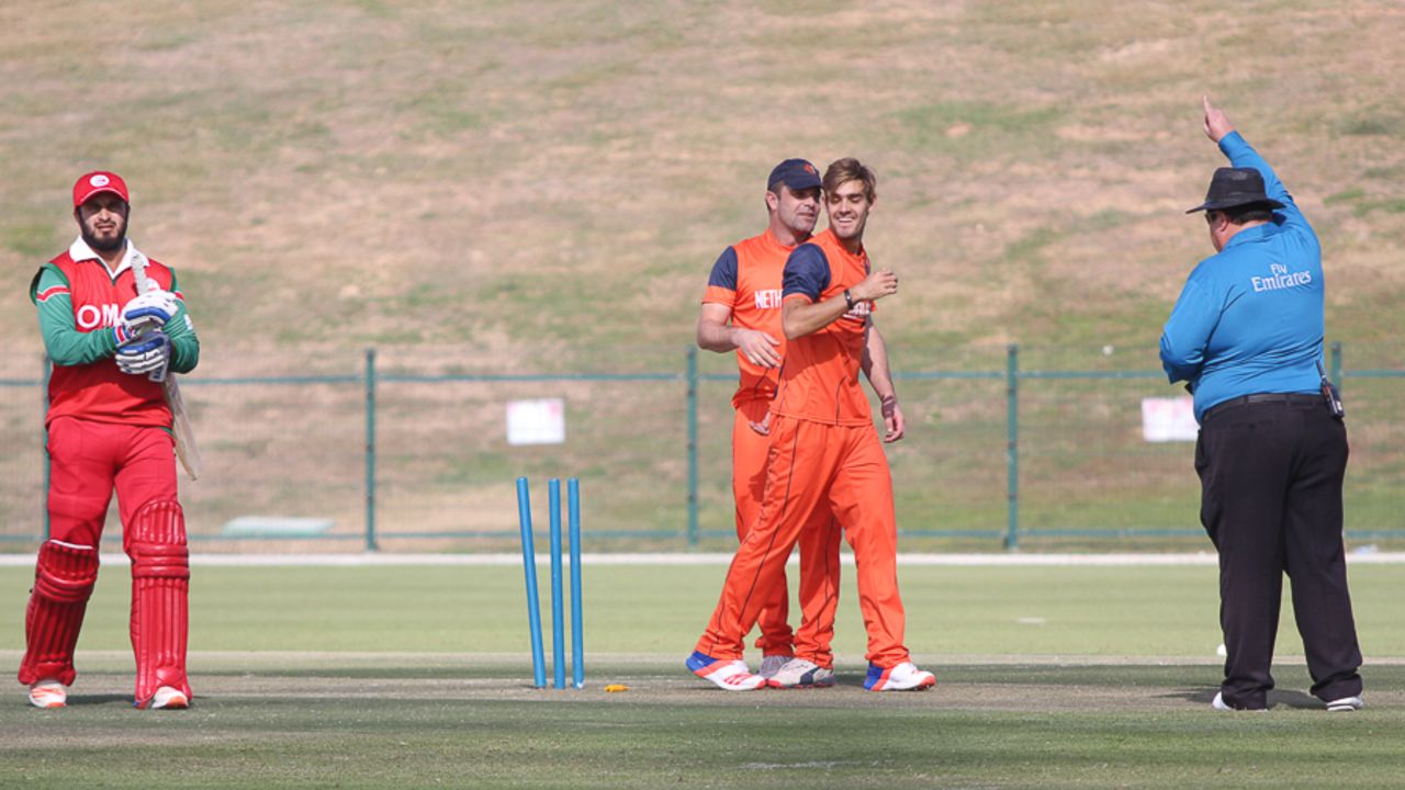 Michael Rippon can't believe his luck after deflecting a drive into stumps to run out Zeeshan Maqsood, Netherlands v Oman, Desert T20, Group B, Abu Dhabi, January 15, 2017
