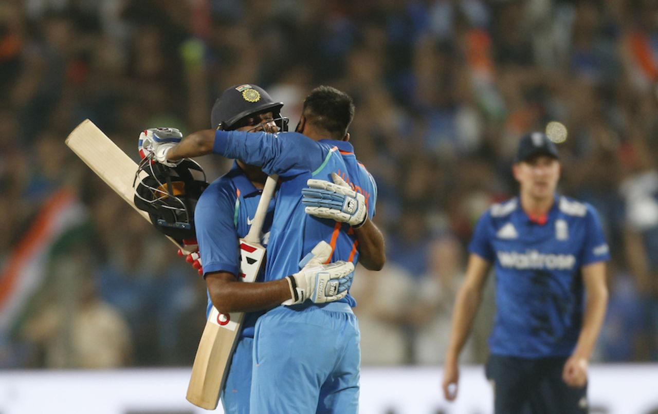 R Ashwin gets a hug from Hardik Pandya after hitting the winning runs, India v England, 1st ODI, Pune, January 15, 2017