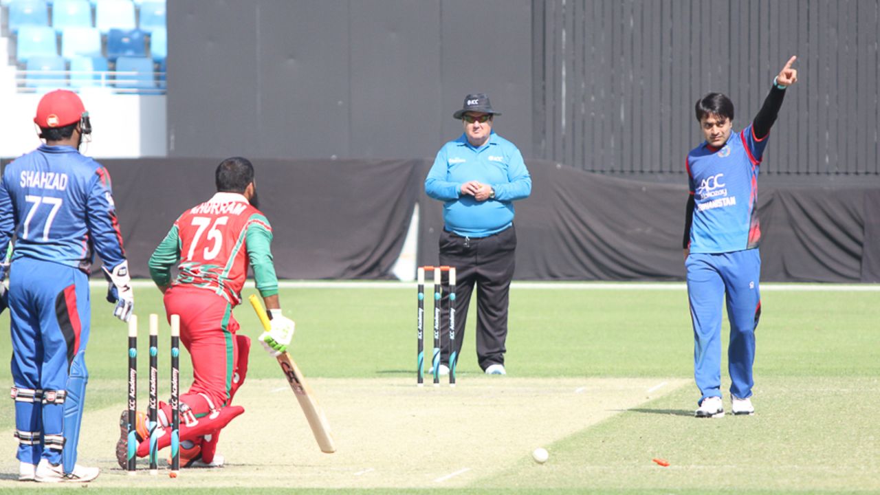 Rashid Khan points Khurram Khan back to the dugout after bowling him for 24, Afghanistan v Oman, Desert T20, 1st semi-final, Dubai, January 20, 2017