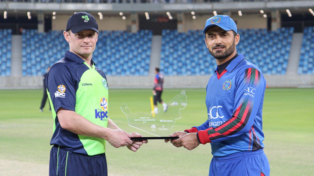 William Porterfield and Nawroz Mangal hold the tournament trophy ahead of the inaugural final, Afghanistan v Ireland, Desert T20, Final, Dubai, January 20, 2017