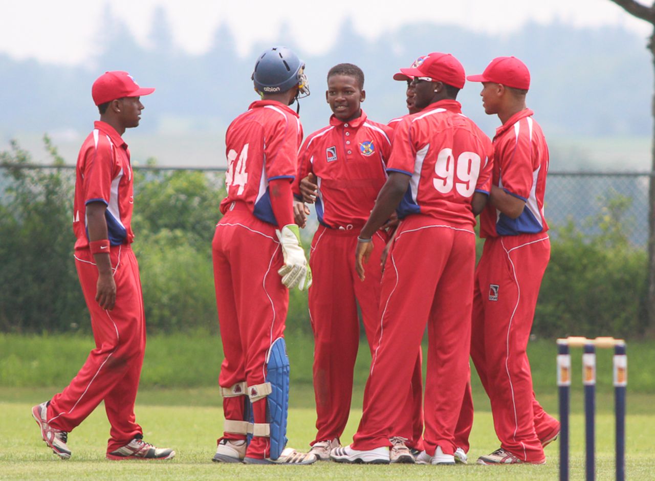 Delray Rawlins gets congratulated after he finished with figures of 5 for 51, Bermuda v USA, ICC Americas Under-19 Championship, Division 1, King City, July 8, 2013