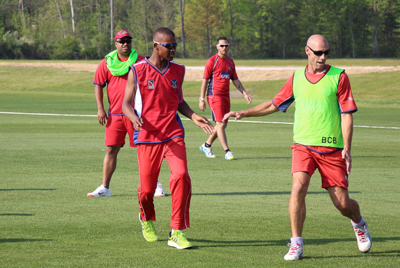 Delray Rawlins and David Hemp go after the ball in a football warm-up, United States of America v Bermuda, ICC Americas Region Division One Twenty20, May 7, 2015