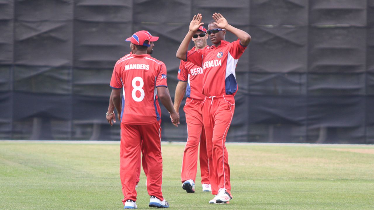 Delray Rawlins goes to high five Tre Manders for taking a catch to remove Nitish Kumar, Bermuda v Canada, ICC Americas Region Division One Twenty20, Indianapolis, May 8, 2015