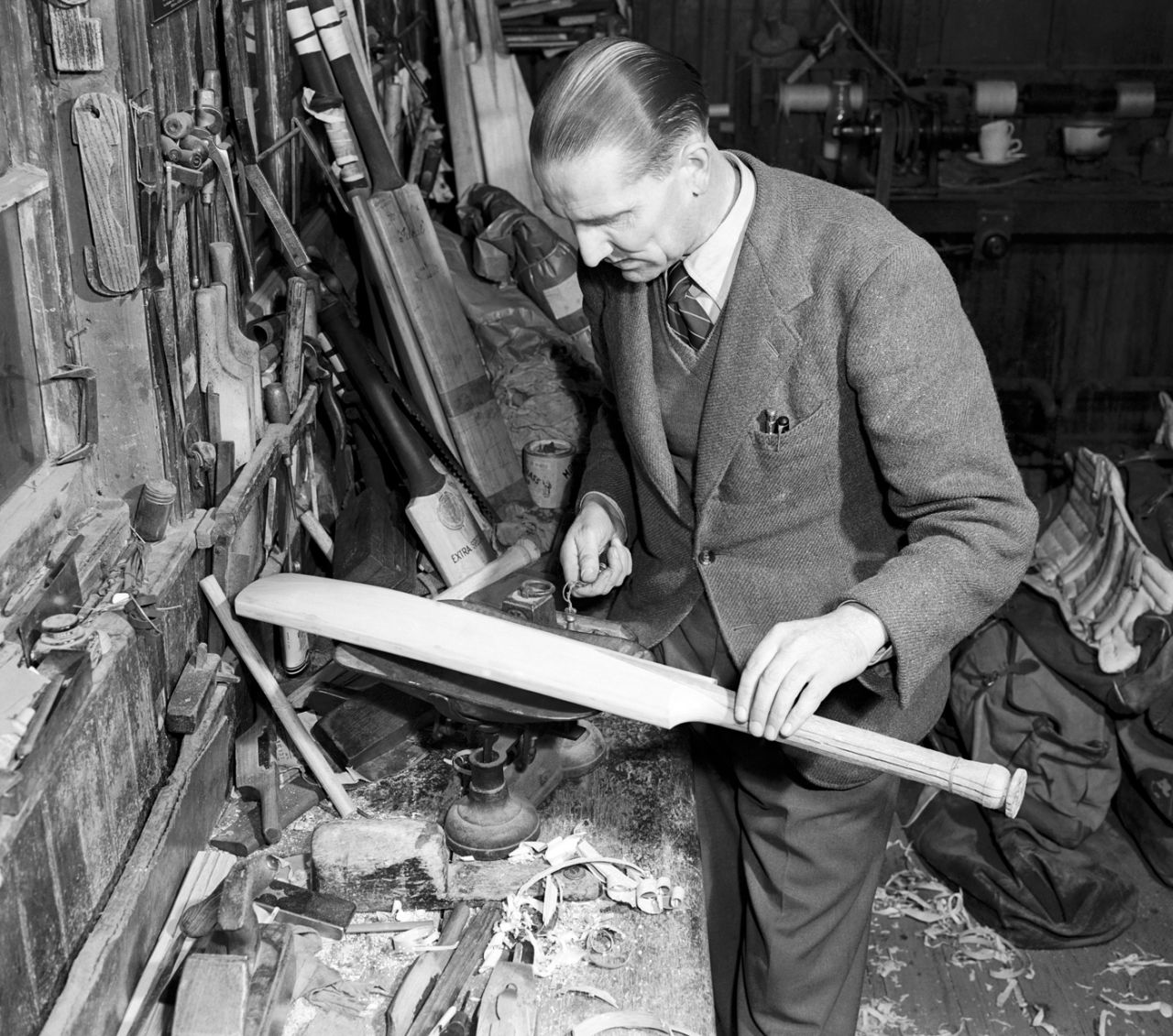 A cricket bat is weighed during the manufacturing process