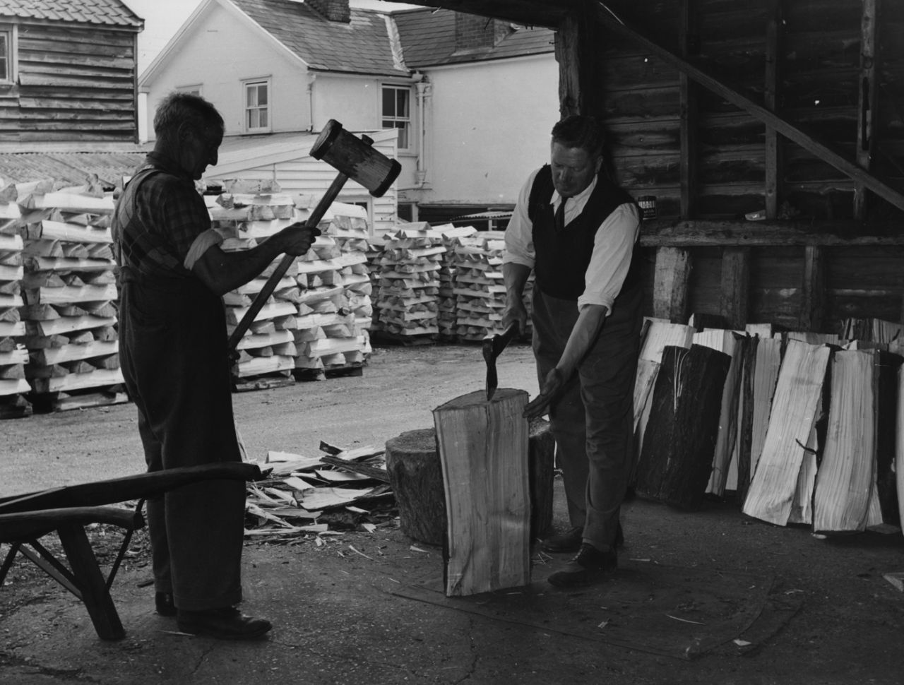 A willow trunk is prepared in a bat factory in Essex, June 21, 1956