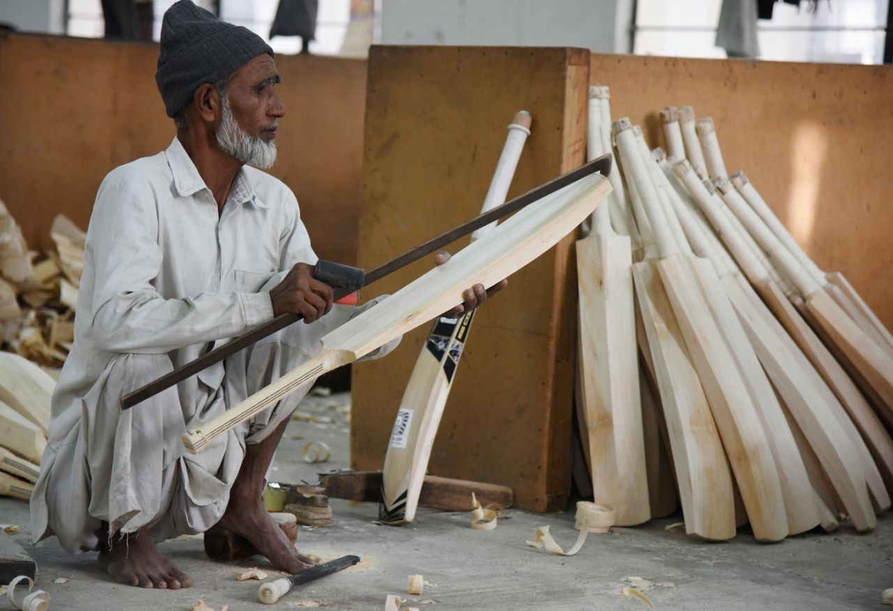 A craftsman works on a bat in a factory in Meerut, December 14, 2016