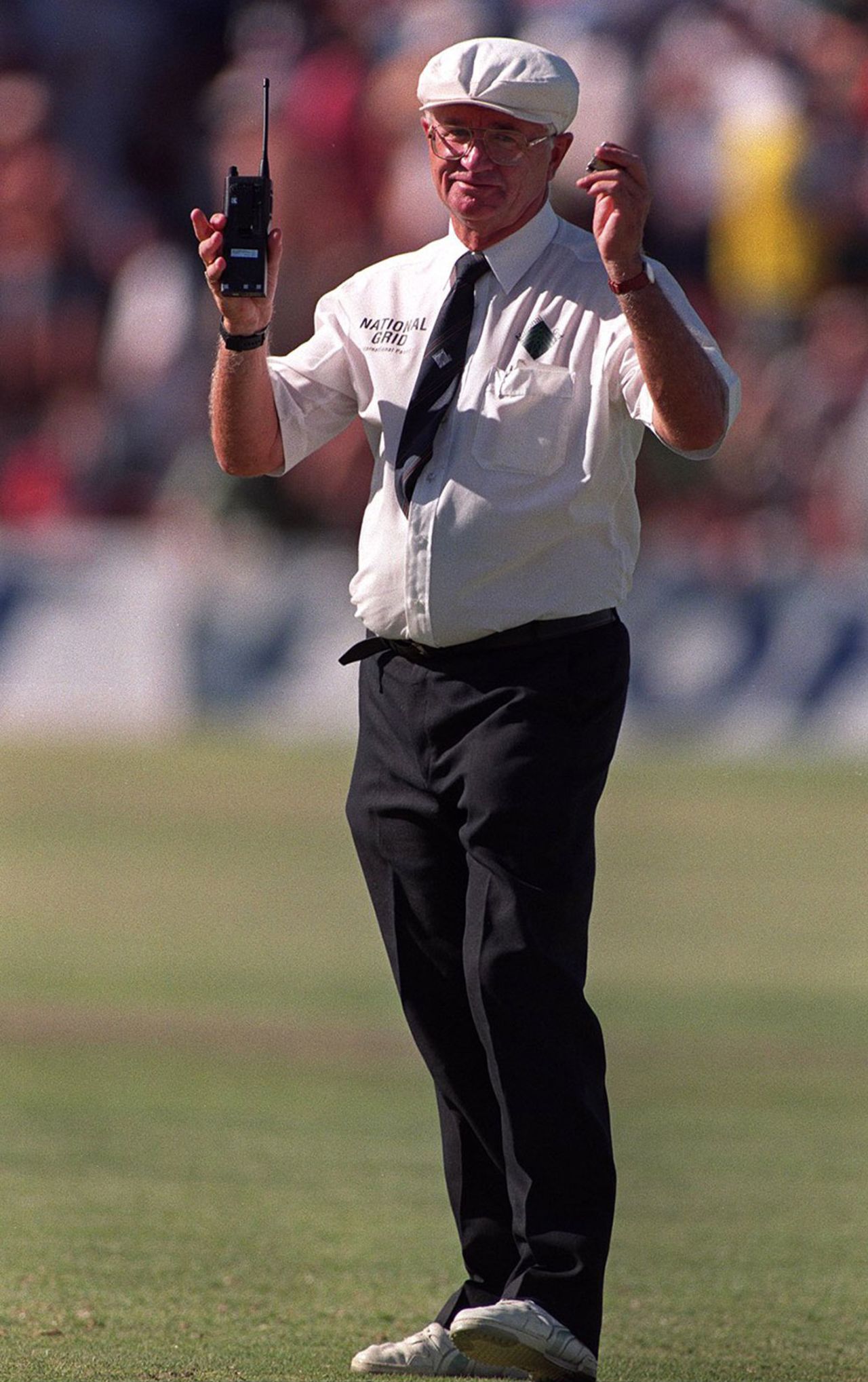 Umpire Cyril Mitchley talks to the third umpire via walkie talkie, South Africa v England, 4th Test, Port Elizabeth, 4th day, December 29, 1995